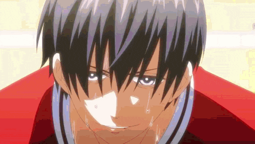 a close up of a person 's face with tears coming out of his eyes