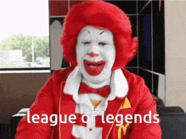 a mcdonald 's clown with the words league of legends written on the bottom