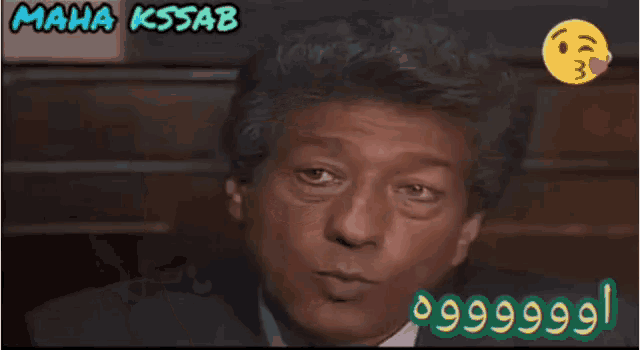 a man in a suit and tie with maha kssab written on the bottom right