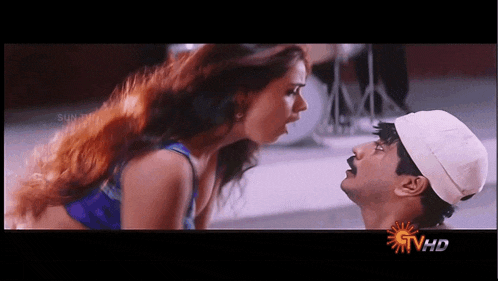 a man and a woman are looking at each other on a screen that says ' stvhd ' on it