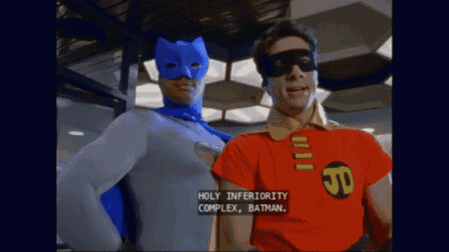 batman and robin are standing next to each other with holy inferiority complex on the screen