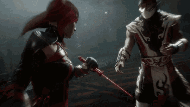 a woman holding a red sword stands next to a man