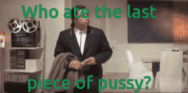 a man in a suit is standing in a room with the words who ate the last piece of pussy below him