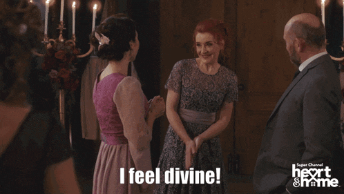 a woman in a purple dress says " i feel divine " in front of a man in a suit