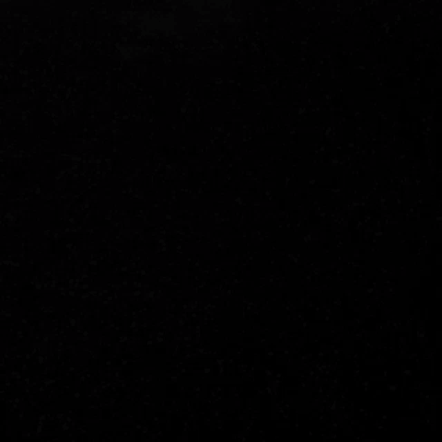 a black background with a lot of white dots on it .