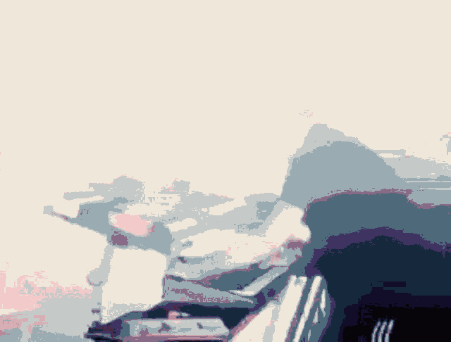 a blurry picture of a man playing a piano