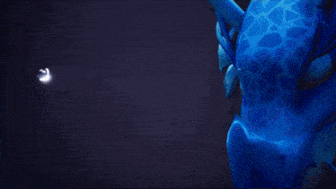 a blue object with a white light coming out of it in the dark
