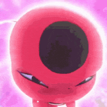a close up of a pink cartoon character with a black hole in the middle of his head .