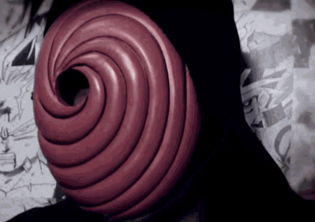 a close up of a red swirl shaped object