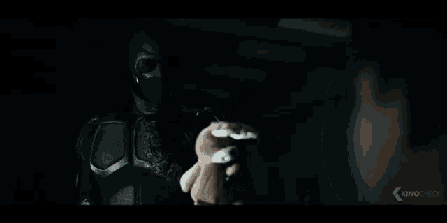 a stuffed bunny rabbit is sitting in the dark in a dark room .