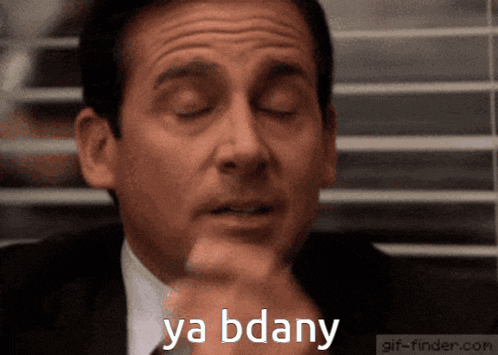 a man in a suit and tie says ya bdany with his eyes closed