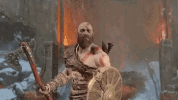 a man with a beard and a sword is holding another man in his arms and says yes .