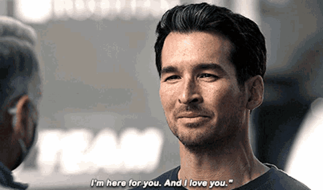 a man says " i 'm here for you and i love you " while talking to another man