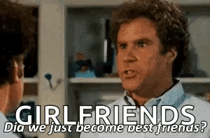 a man is talking to another man in a room and they are talking about girlfriends .