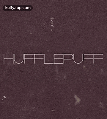 the word hufflepuff is written on a brown background .