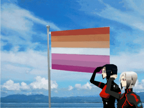 a couple of people standing in front of a flag that says lgbt