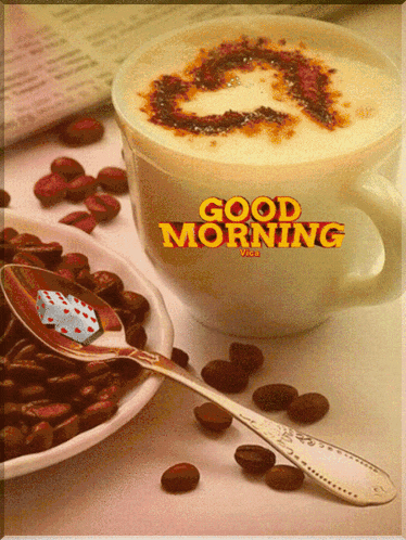 a cup of coffee with a heart drawn on it and the words good morning on it