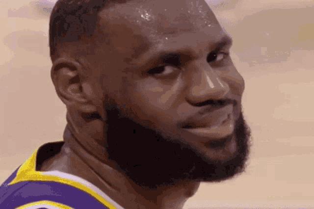 a close up of lebron james ' face with sweat on his face