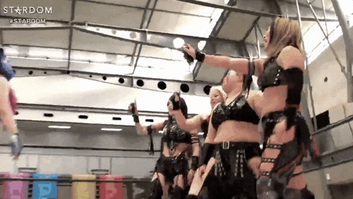 a group of women are standing in a room with the word stardom on the top