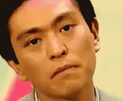 a close up of a man 's face with his eyes closed
