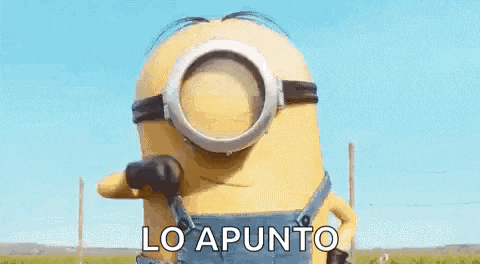 a minion wearing overalls and glasses with the words muy bien lo apunto written on it .