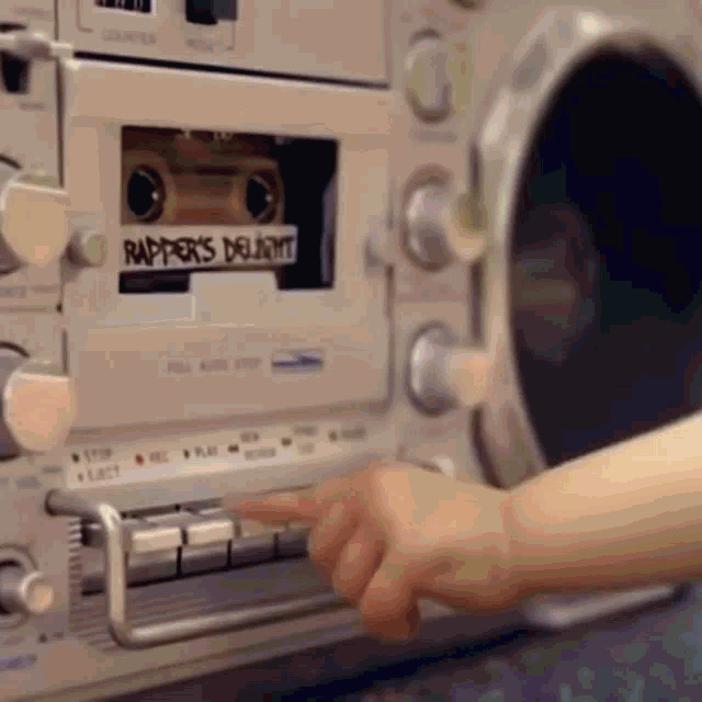 a rapper 's delight cassette is being played on a boombox