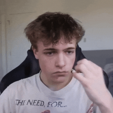 a young man wearing a shirt that says " the need for " on it