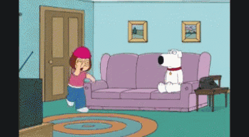 a girl in a pink hat stands next to a purple couch