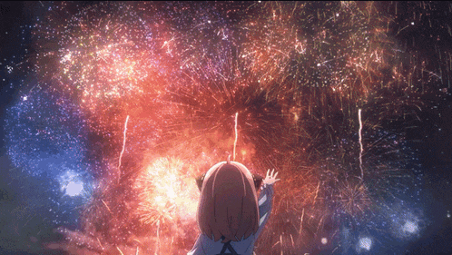 a little girl looks up at a fireworks display