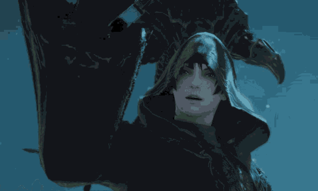 a person with a hood on their head looks at the camera