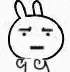 a black and white drawing of a rabbit with a serious face and a tail .
