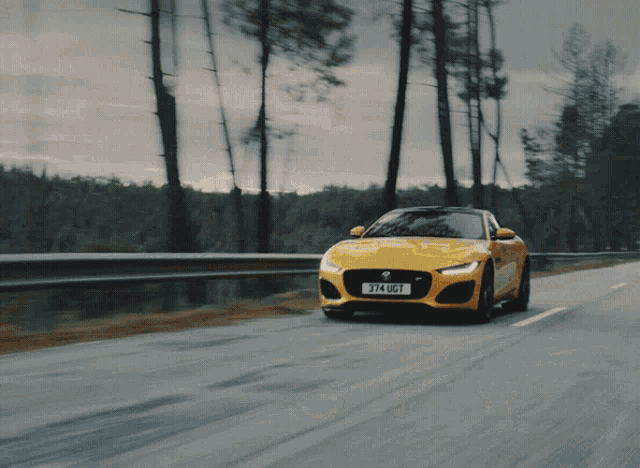 a yellow sports car with a license plate reading 374 ugt