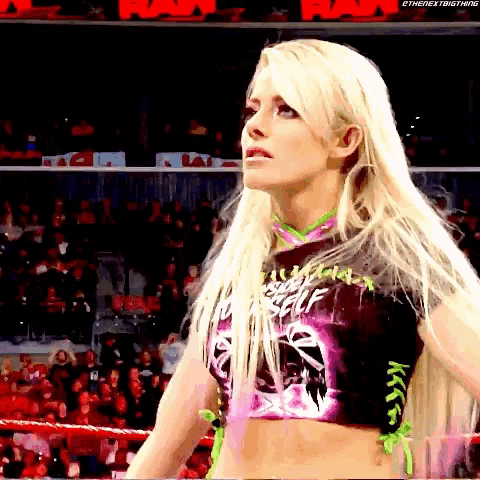 a woman in a wrestling ring is wearing a shirt that says " always be yourself " on it