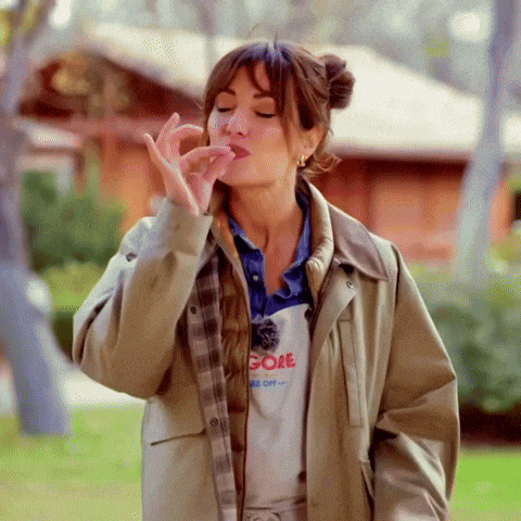 a woman wearing a jacket and a shirt that says gore