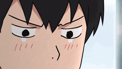 a close up of a person 's face with a tear coming out of it