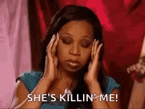 a woman is holding her head in her hands and says `` she 's killin ' me '' .