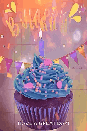 a cupcake with blue frosting and a candle on it