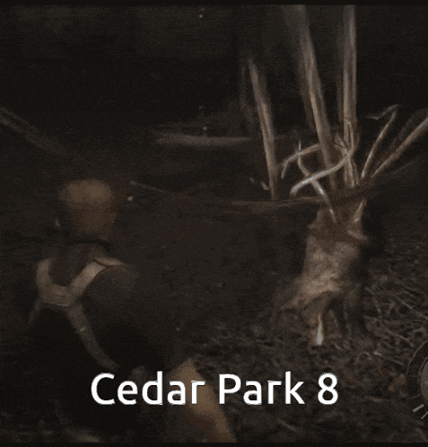 a man holding a dead animal in a cedar park 8 photo