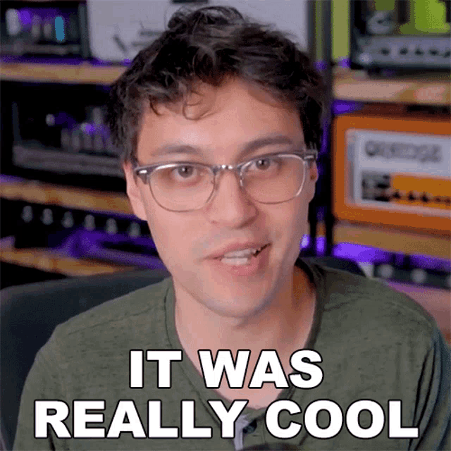 a man with glasses and a green shirt says it was really cool