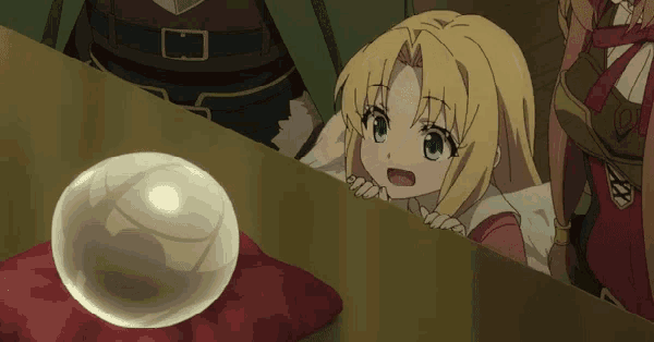 a girl looks over a table at a sphere