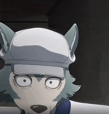 a close up of a cartoon wolf wearing a hat and looking at the camera .