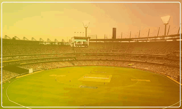 a stadium filled with people playing a game of cricket and a sign that says ' cricket ' on it