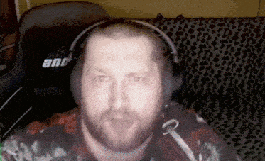 a man wearing headphones and a shirt that says and on it