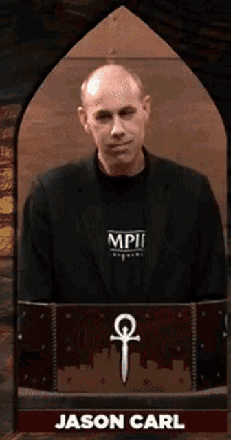 a man wearing a black jacket and a shirt that says mpif
