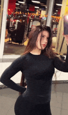 a woman taking a selfie in a gym