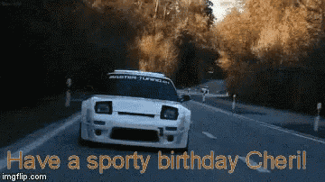a white car is driving down a road with the words " have a sporty birthday cheril "