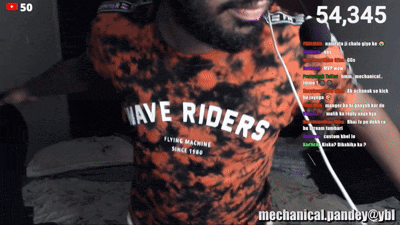 a man wearing a shirt that says wave riders flying machine