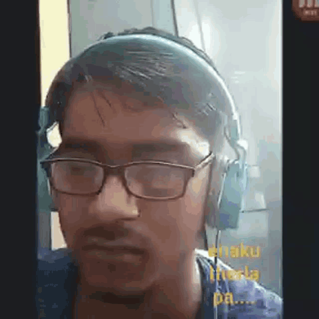 a man wearing glasses and headphones is talking on a video call