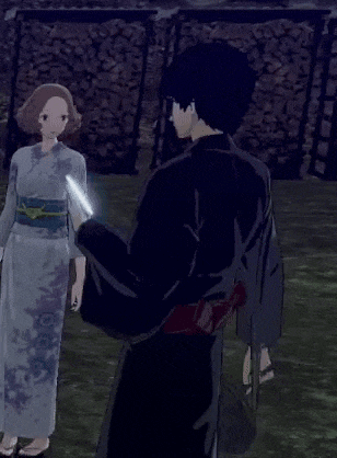 a man in a kimono is standing next to a woman in a kimono .