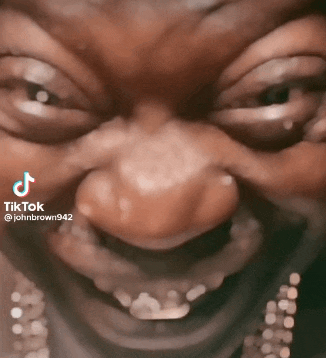 a close up of a man 's face with a tiktok watermark